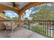 Outdoor balcony with comfortable seating, fan and nice views of the neighborhood at 2828 Northampton Ave, Orlando, FL 32828