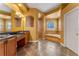 Luxurious bathroom featuring a soaking tub, walk-in shower, dual vanities, and elegant finishes at 2828 Northampton Ave, Orlando, FL 32828