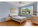 Bright bedroom with large window, wood floors, and modern decor at 2828 Northampton Ave, Orlando, FL 32828