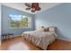 Comfortable bedroom featuring a large window with a backyard view at 2828 Northampton Ave, Orlando, FL 32828