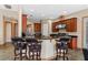 Spacious kitchen with black granite countertops, stainless steel appliances, and a breakfast bar with seating at 2828 Northampton Ave, Orlando, FL 32828