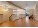 Spacious landing with decorative chandelier, wood floors, and wrought iron banister at 2828 Northampton Ave, Orlando, FL 32828