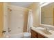 The bathroom features a shower-tub combo with neutral tile and a vanity with a sink at 2930 S Semoran Blvd # 408, Orlando, FL 32822