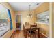 Cozy dining room with hardwood floors and a view to the kitchen at 2930 S Semoran Blvd # 408, Orlando, FL 32822