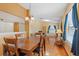 Inviting dining area with hardwood floors adjacent to the living room at 2930 S Semoran Blvd # 408, Orlando, FL 32822