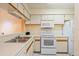 Functional kitchen with white appliances and ample counter space at 2930 S Semoran Blvd # 408, Orlando, FL 32822