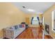 Inviting living room with fireplace, hardwood floors, and plenty of natural light at 2930 S Semoran Blvd # 408, Orlando, FL 32822