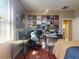 Bedroom featuring hardwood floors, album art and a desk area at 3216 Rolling Hills Ln, Apopka, FL 32712