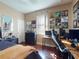 Comfortable bedroom with record album art and desk area at 3216 Rolling Hills Ln, Apopka, FL 32712