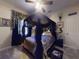 Themed bedroom with a dramatic canopy bed, unique decor, and soft lighting at 3216 Rolling Hills Ln, Apopka, FL 32712