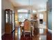 Dining room features a dark wood table, six upholstered chairs, two wooden china cabinets, and access to other rooms at 3216 Rolling Hills Ln, Apopka, FL 32712