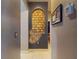Hallway with unique brick arch feature and thermostat on the wall at 3216 Rolling Hills Ln, Apopka, FL 32712