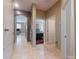 Tiled hallway leading to a bedroom and living area at 3216 Rolling Hills Ln, Apopka, FL 32712