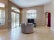 Spacious living room features tile flooring, access to pool, and natural lighting at 3216 Rolling Hills Ln, Apopka, FL 32712