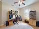Functional office space with neutral carpet, ceiling fan, and desk area, providing a comfortable work environment at 3216 Rolling Hills Ln, Apopka, FL 32712