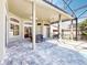 Spacious lanai featuring a swing, seating and dining areas, showcasing a desirable outdoor lifestyle at 3216 Rolling Hills Ln, Apopka, FL 32712
