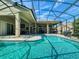 Stunning screened-in pool with a raised spa and a spacious covered patio for entertaining at 3216 Rolling Hills Ln, Apopka, FL 32712
