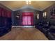 Cozy theater room with tiered seating, movie posters, and dim lighting at 3216 Rolling Hills Ln, Apopka, FL 32712