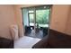 Balcony features outdoor seating, beautiful green scenery, and sliding glass doors for natural light at 3316 Bellissimo Ave, Kissimmee, FL 34746
