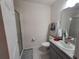 Neat bathroom with a shower, vanity, granite countertop, sink, and chrome hardware at 3316 Bellissimo Ave, Kissimmee, FL 34746
