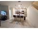 Open-concept kitchen featuring a modern island with seating, pendant lights, and stainless steel appliances at 3316 Bellissimo Ave, Kissimmee, FL 34746