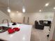 Bright and spacious living area, adjacent to kitchen, with contemporary decor and furnishings at 3316 Bellissimo Ave, Kissimmee, FL 34746