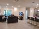 Bright living room featuring tile floors, recessed lighting, and sliding doors to a private patio at 3316 Bellissimo Ave, Kissimmee, FL 34746