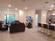 Bright living room featuring tile floors, recessed lighting, and sliding doors to a private patio at 3316 Bellissimo Ave, Kissimmee, FL 34746