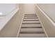 A staircase with white risers and treads with a white railing at 3316 Bellissimo Ave, Kissimmee, FL 34746