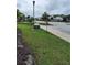 Street view of the community with well-maintained landscaping and sidewalks at 3316 Bellissimo Ave, Kissimmee, FL 34746