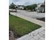 Street view of the community with well-maintained landscaping and sidewalks at 3316 Bellissimo Ave, Kissimmee, FL 34746