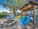 The backyard features a fire pit and an outdoor kitchen with bar seating, ideal for entertaining and relaxation at 3443 Arnel Dr, Winter Park, FL 32792