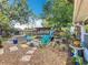 Spacious backyard featuring a fire pit, colorful Adirondack chairs, and mature trees at 3443 Arnel Dr, Winter Park, FL 32792