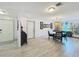 The dining room has hardwood flooring and a designer light fixture at 3443 Arnel Dr, Winter Park, FL 32792