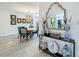 A dining room area features a large mirror and view of kitchen at 3443 Arnel Dr, Winter Park, FL 32792
