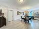 Dining room features chandelier, decor, and white wood flooring at 3443 Arnel Dr, Winter Park, FL 32792
