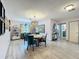 The dining room features modern decor, wood flooring, and ample lighting at 3443 Arnel Dr, Winter Park, FL 32792