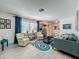 Bright living room with hardwood floors, modern furniture, and large window at 3443 Arnel Dr, Winter Park, FL 32792