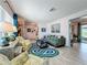 Cozy living room featuring stylish decor, comfortable seating, and modern rug at 3443 Arnel Dr, Winter Park, FL 32792