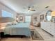 A spacious main bedroom featuring a ceiling fan, light colored walls, and wood floors at 3443 Arnel Dr, Winter Park, FL 32792