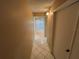 Hallway with neutral walls and glossy tile flooring leading to the living area at 510 Cranes Way # 302, Altamonte Springs, FL 32701