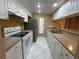 Bright kitchen with white cabinetry, and efficient appliance arrangement at 510 Cranes Way # 302, Altamonte Springs, FL 32701