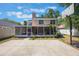 Well-maintained backyard with a basketball court, screened patio, and mature trees at 5113 Mystic Point Ct, Orlando, FL 32812