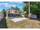 Charming home featuring a screened patio, basketball court, and lush landscaping at 5113 Mystic Point Ct, Orlando, FL 32812