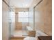 Modern bathroom with walk-in shower, glass block window, and neutral tile at 5113 Mystic Point Ct, Orlando, FL 32812