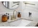 Bathroom vanity featuring white countertop, gold faucet, and decor at 5113 Mystic Point Ct, Orlando, FL 32812