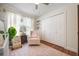 Charming Bedroom with a rocking chair, stylish rug, crib, and a bright window at 5113 Mystic Point Ct, Orlando, FL 32812