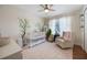 Bright Bedroom featuring a white crib, rocking chair, and pink patterned rug at 5113 Mystic Point Ct, Orlando, FL 32812