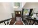 Inviting foyer with a chandelier, double doors, and staircase with black banister at 5113 Mystic Point Ct, Orlando, FL 32812