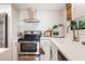 Bright kitchen features stainless steel appliances, white cabinets, and tiled backsplash at 5113 Mystic Point Ct, Orlando, FL 32812